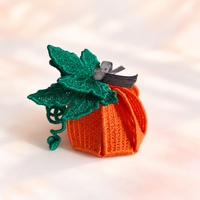 Finished orange 3D Pumpkin FSL gift box with green lace leaves, curling vines and a gray ribbon closure