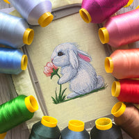 Cute bunny machine embroidery design sniffing a flower, soft spring animal embroidery pattern for kids and creative projects