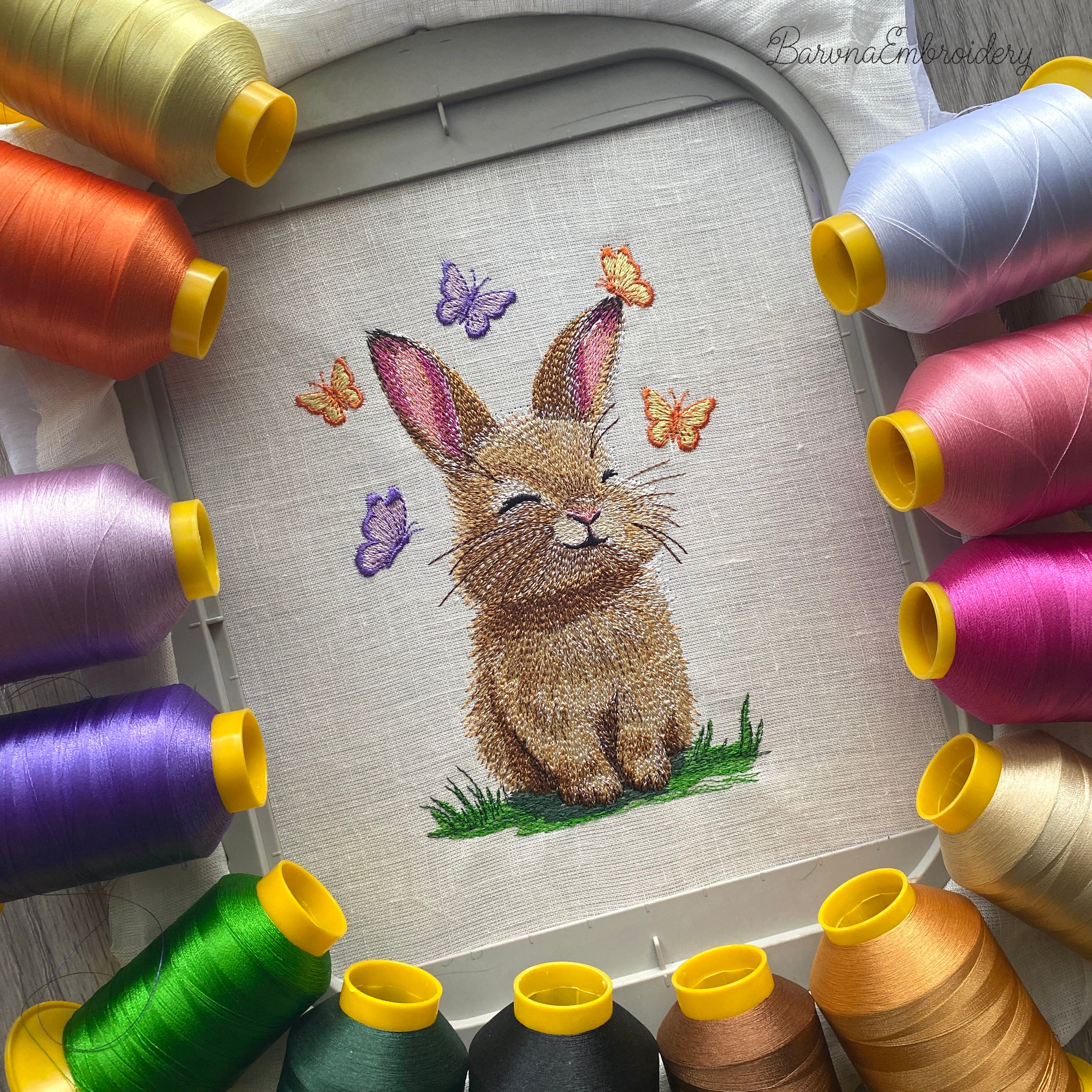 A collection of five high-quality machine embroidery designs: bunnies with butterflies, wildflowers, dandelions, and spring greenery in a realistic style.