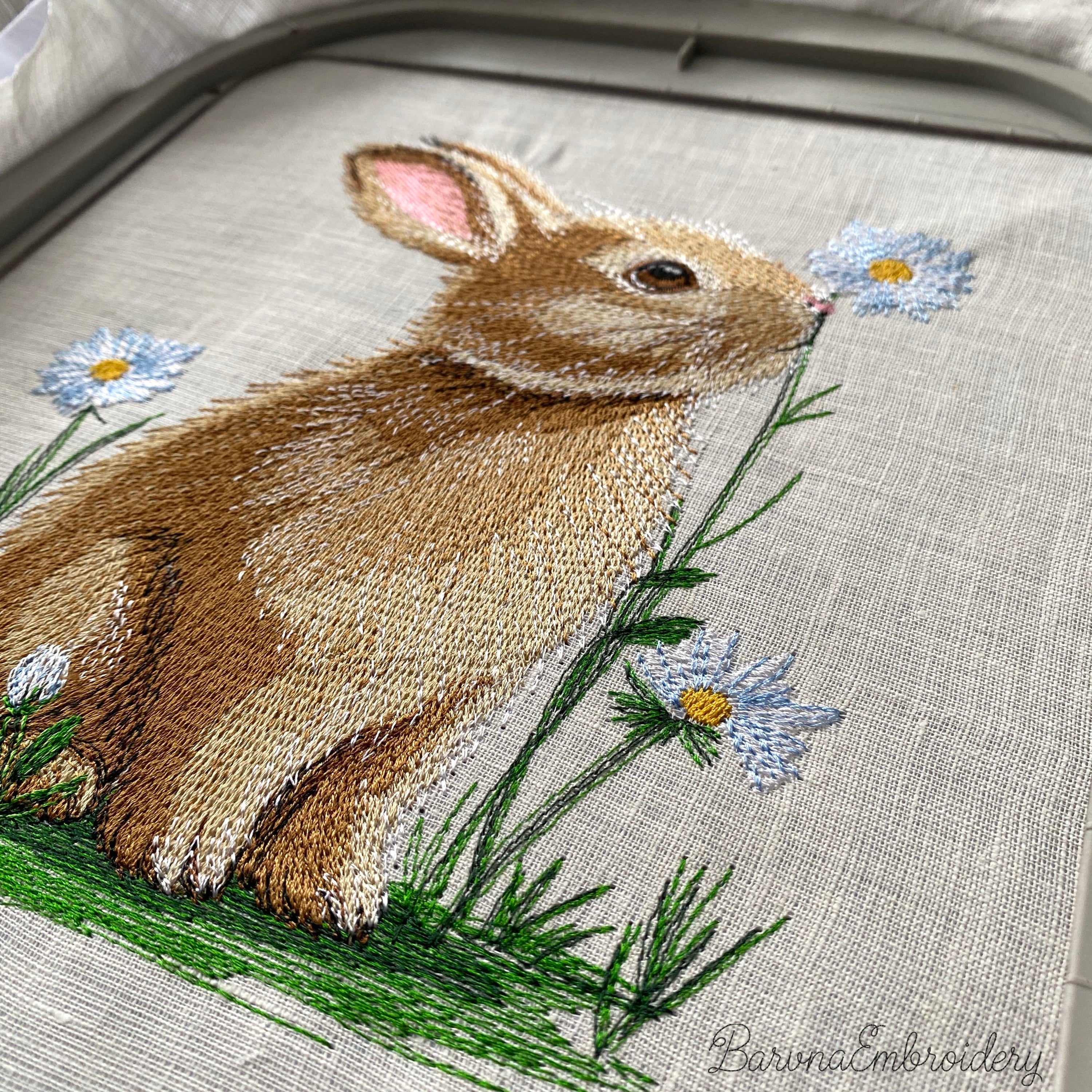 Sitting bunny embroidery design showing detailed stitched rabbit with fluffy texture, animal machine embroidery file