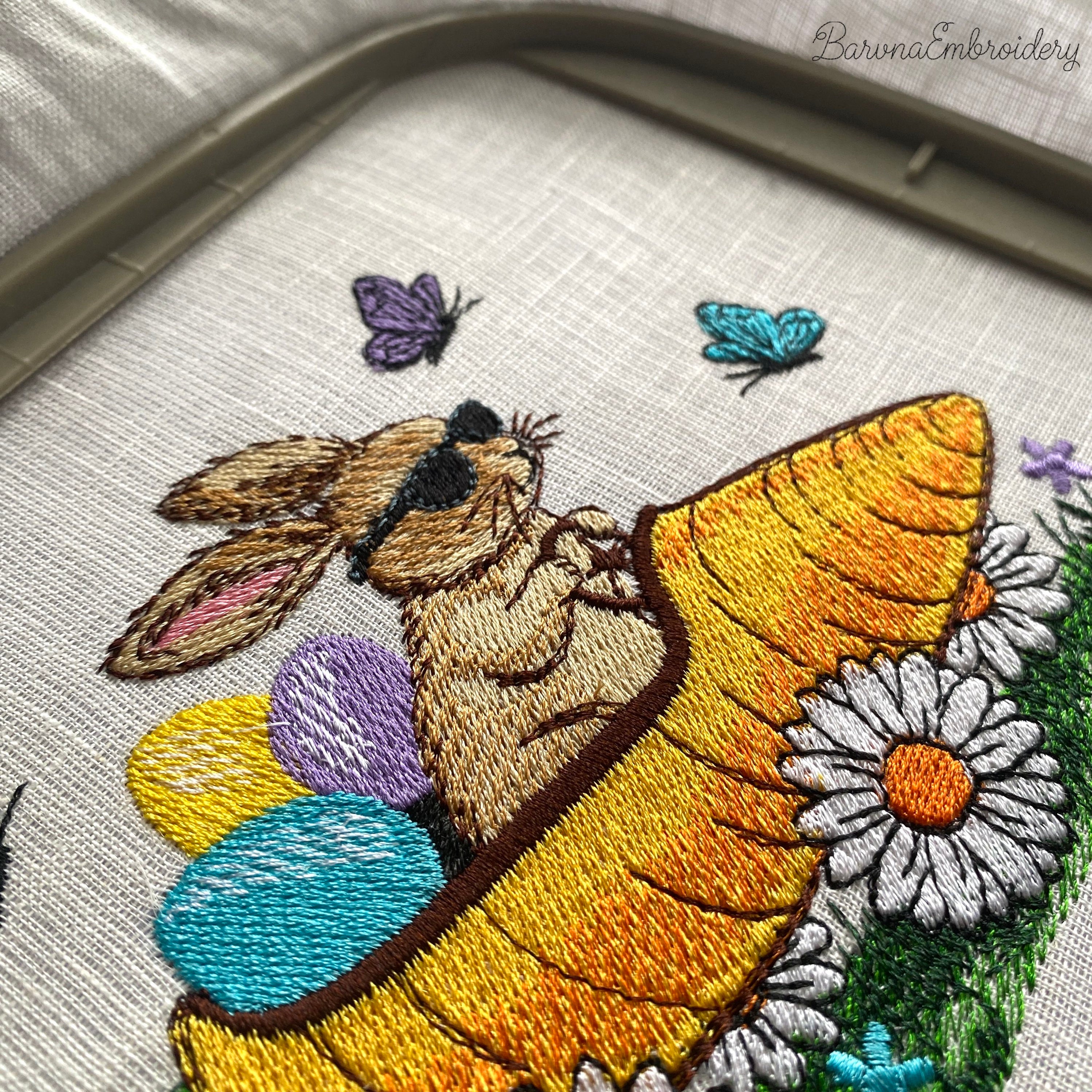 Funny Easter bunny embroidery design with spring theme, rabbit riding carrot with eggs and flowers, colorful machine embroidery file.