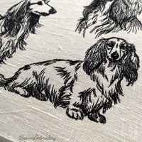 Long haired dachshund classic sitting pose machine embroidery file.