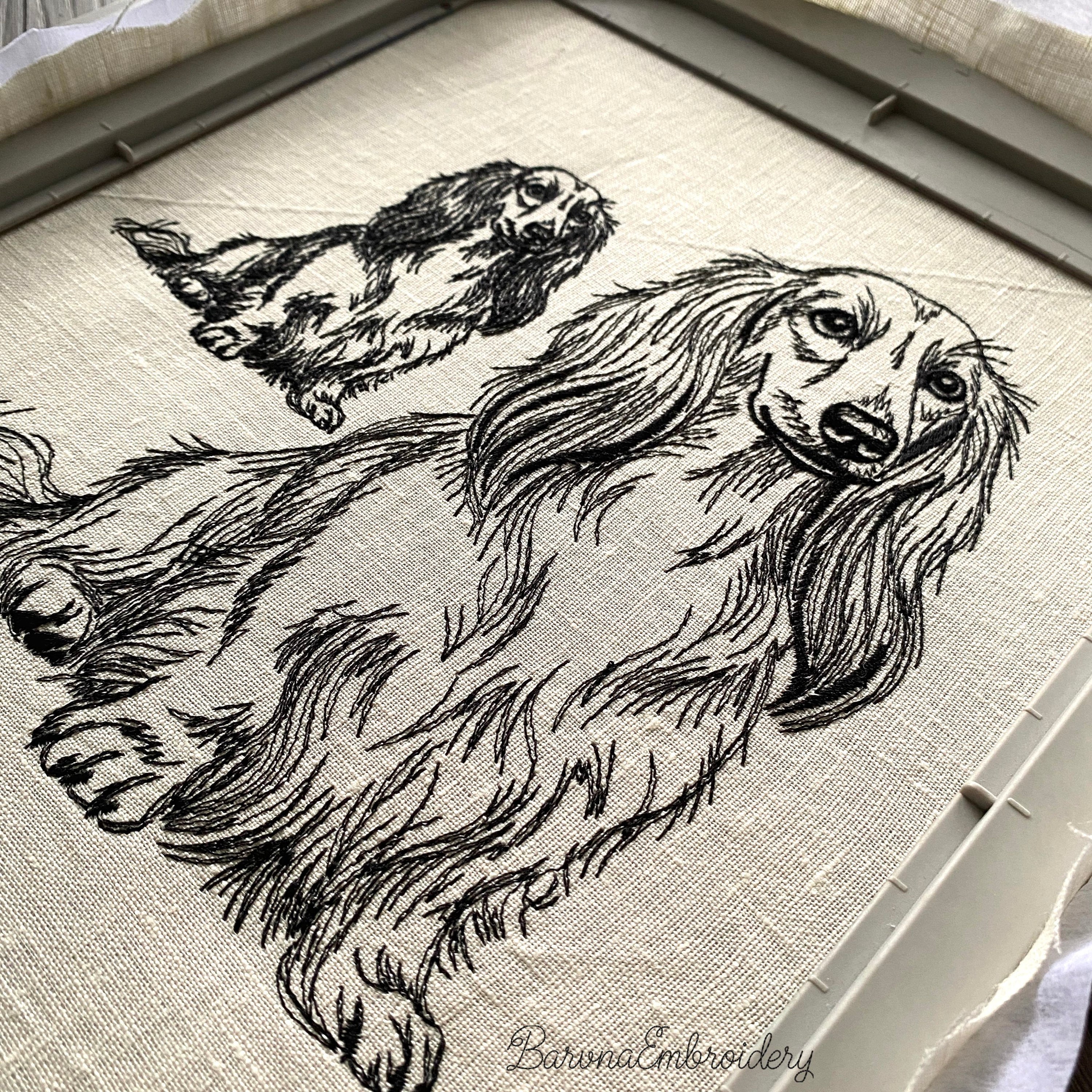 Long haired dachshund sitting upright single color embroidery design.