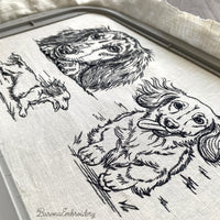 Long haired dachshund running front view line art embroidery file.