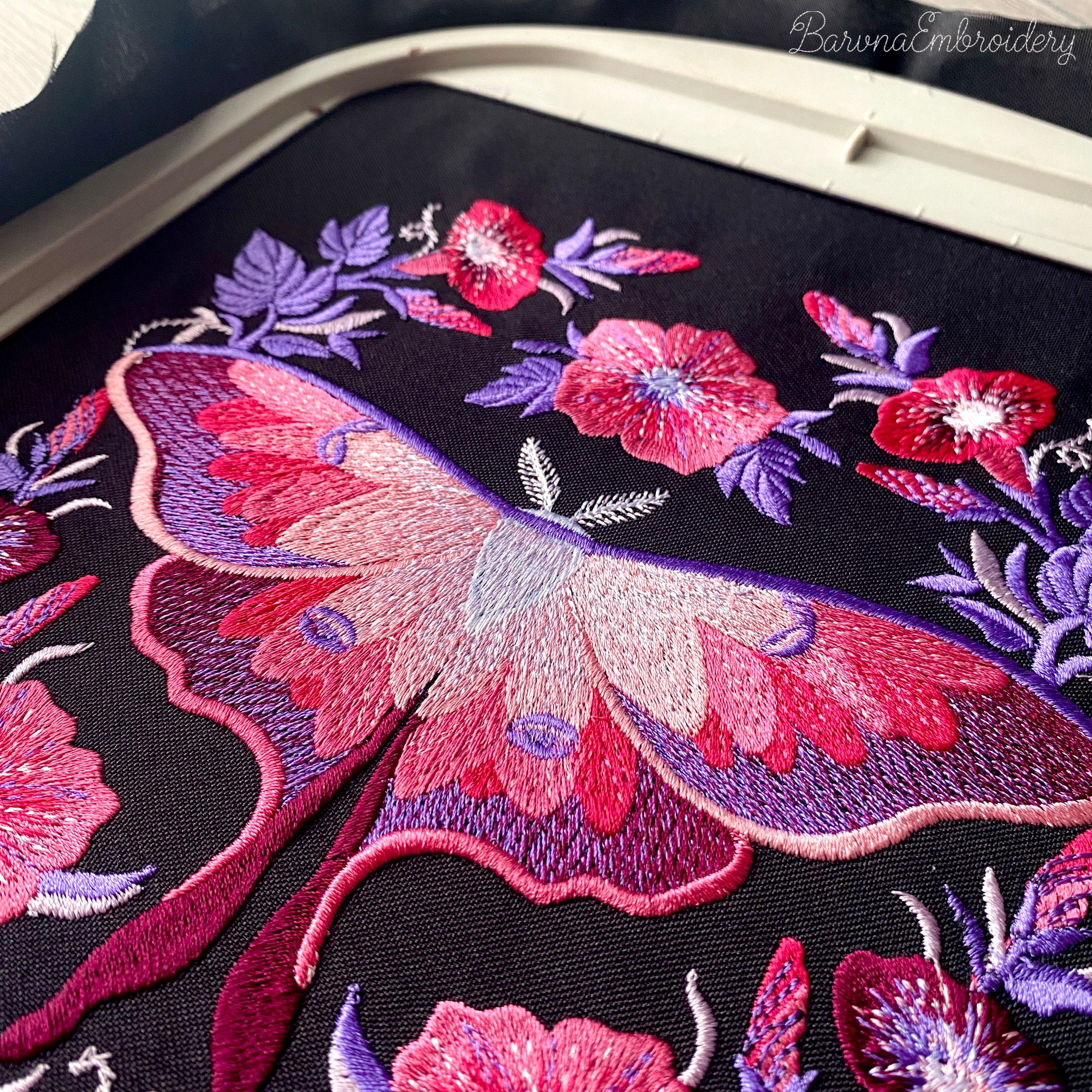 Four luna moth machine embroidery designs with celestial and decorative elements