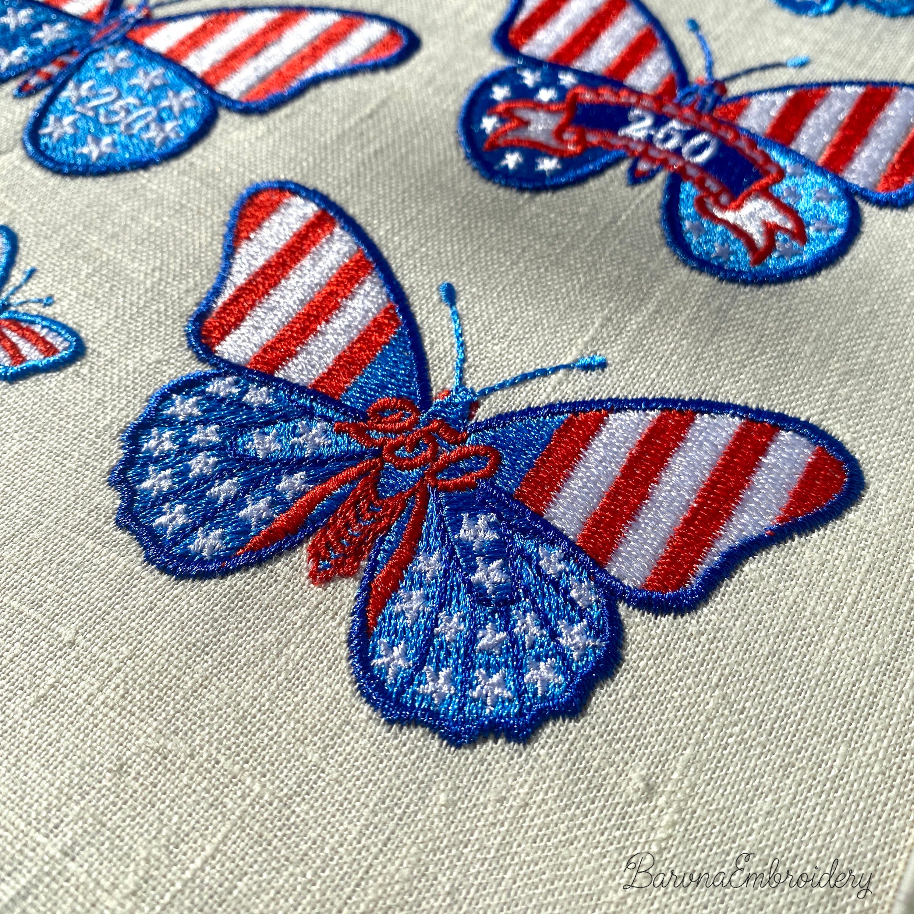 Patriotic butterfly machine embroidery design with decorative stars and number detail.