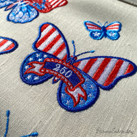 Patriotic butterfly machine embroidery designs in red white and blue with stars stripes and 250 celebration theme.