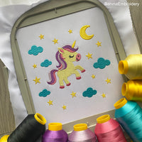 Cute unicorn embroidery design surrounded by stars, moon, and clouds – perfect for baby girl clothes, pillows, or nursery decor.