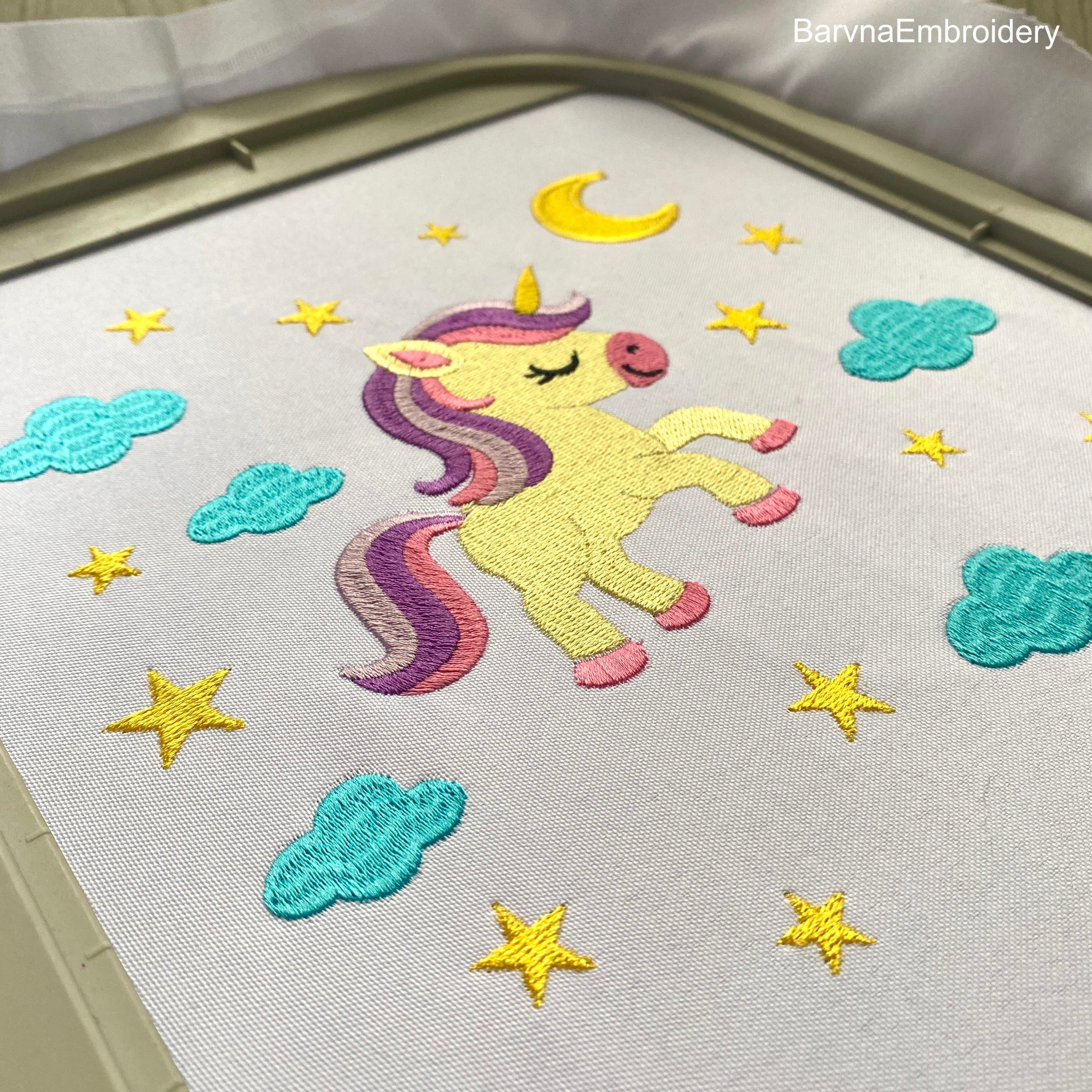 Cute unicorn embroidery design surrounded by stars, moon, and clouds – perfect for baby girl clothes, pillows, or nursery decor.