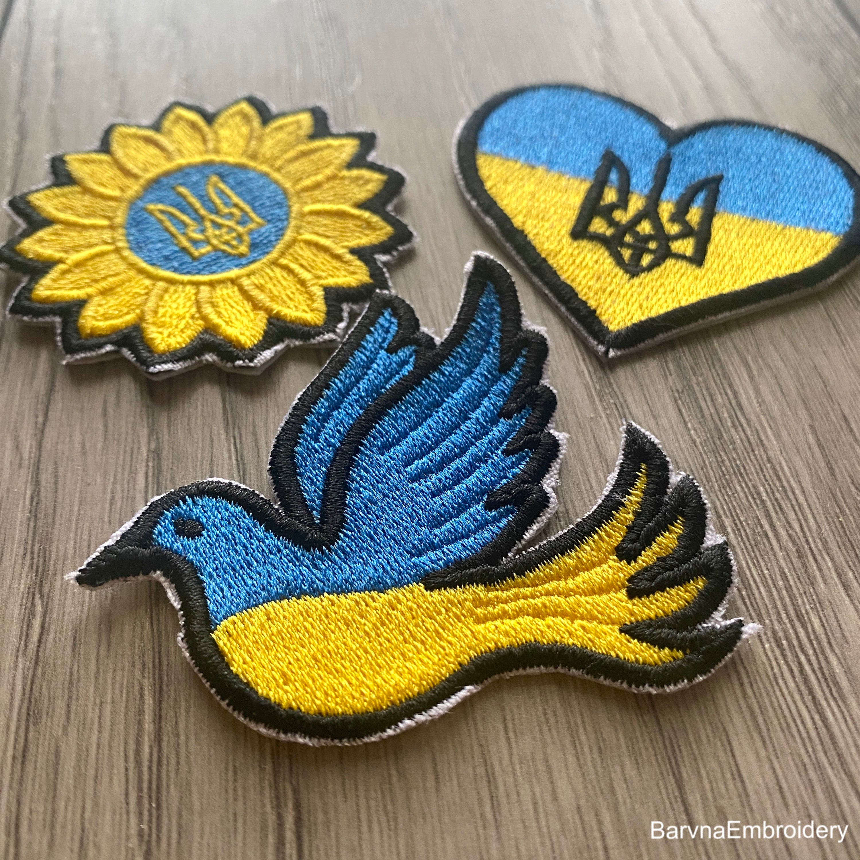 Ukrainian flag embroidery design shaped like a dove with a satin border – ideal for patches or stitching on shirts, bags, or decor.