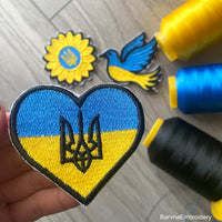 Heart-shaped Ukrainian flag embroidery with wheat stalks and satin border – perfect as a patch or for decorating clothes and bags.