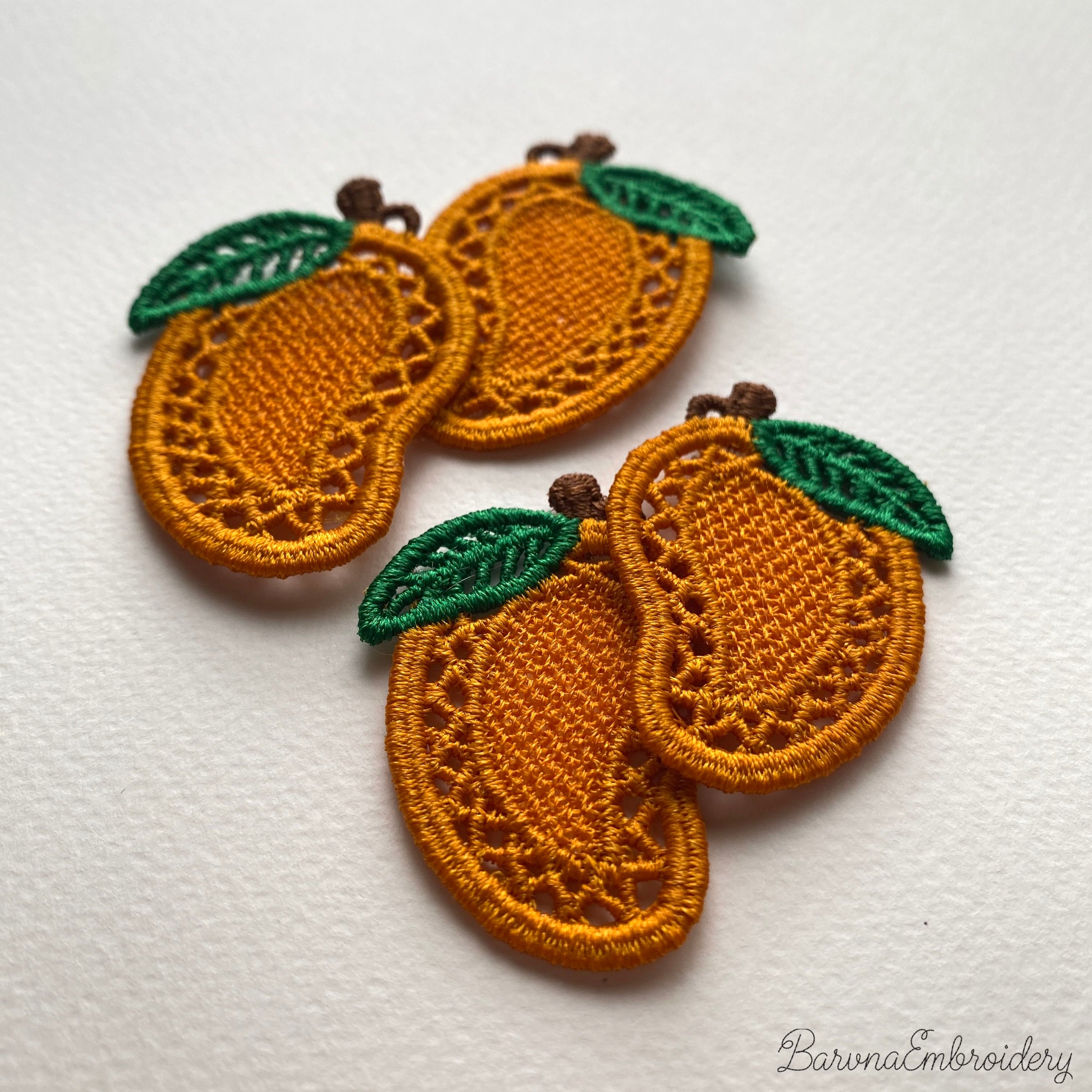 FSL mango embroidery designs in two sizes with mirrored pairs — golden lace body with green leaf — shown as design preview and finished stitched result, Free Standing Lace machine embroidery pattern for earrings and charms.