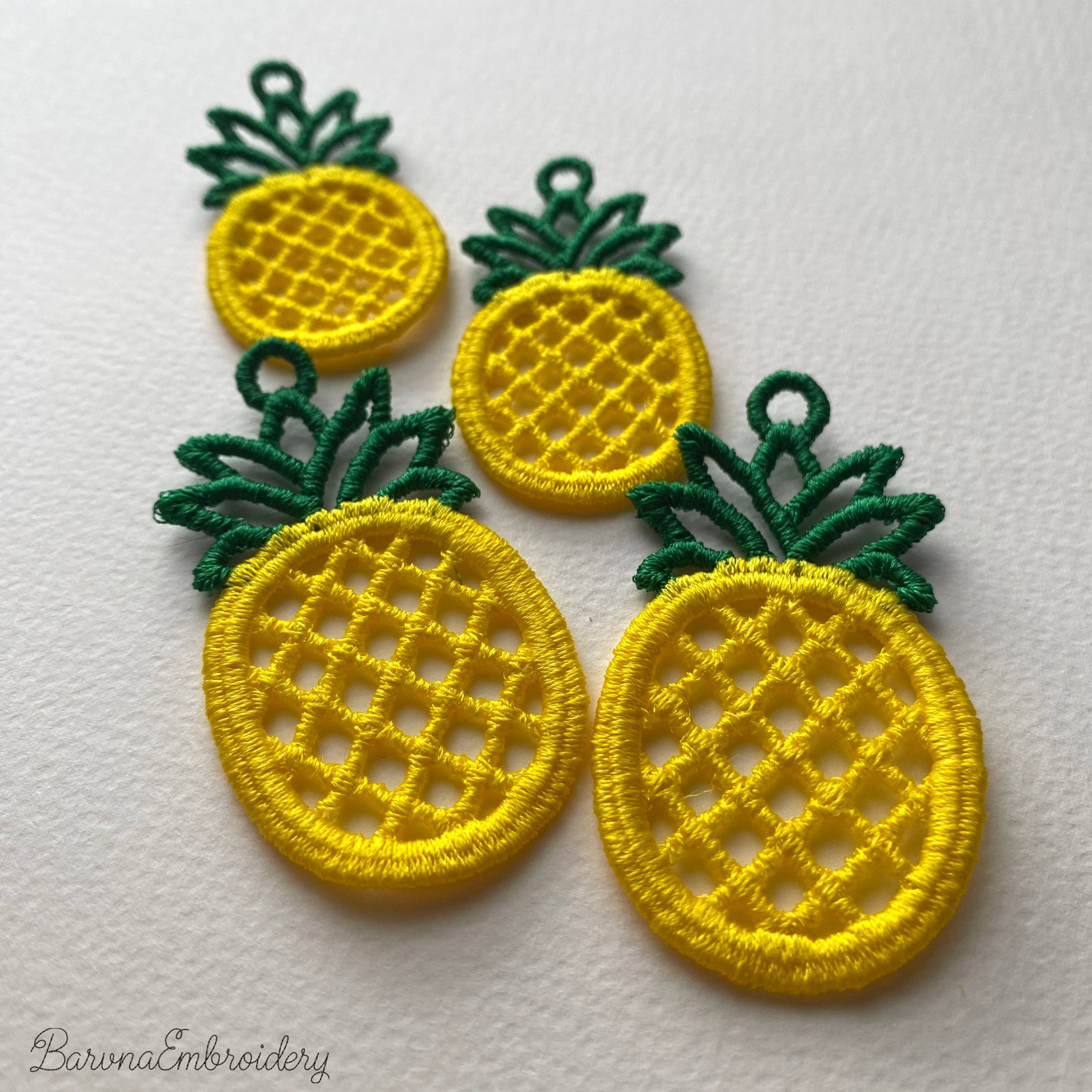 FSL pineapple embroidery design previews — yellow lace body with green crown and hanging loop — Free Standing Lace machine embroidery pattern for earrings and pendants.