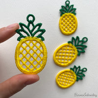 FSL pineapple embroidery design previews — yellow lace body with green crown and hanging loop — Free Standing Lace machine embroidery pattern for earrings and pendants.