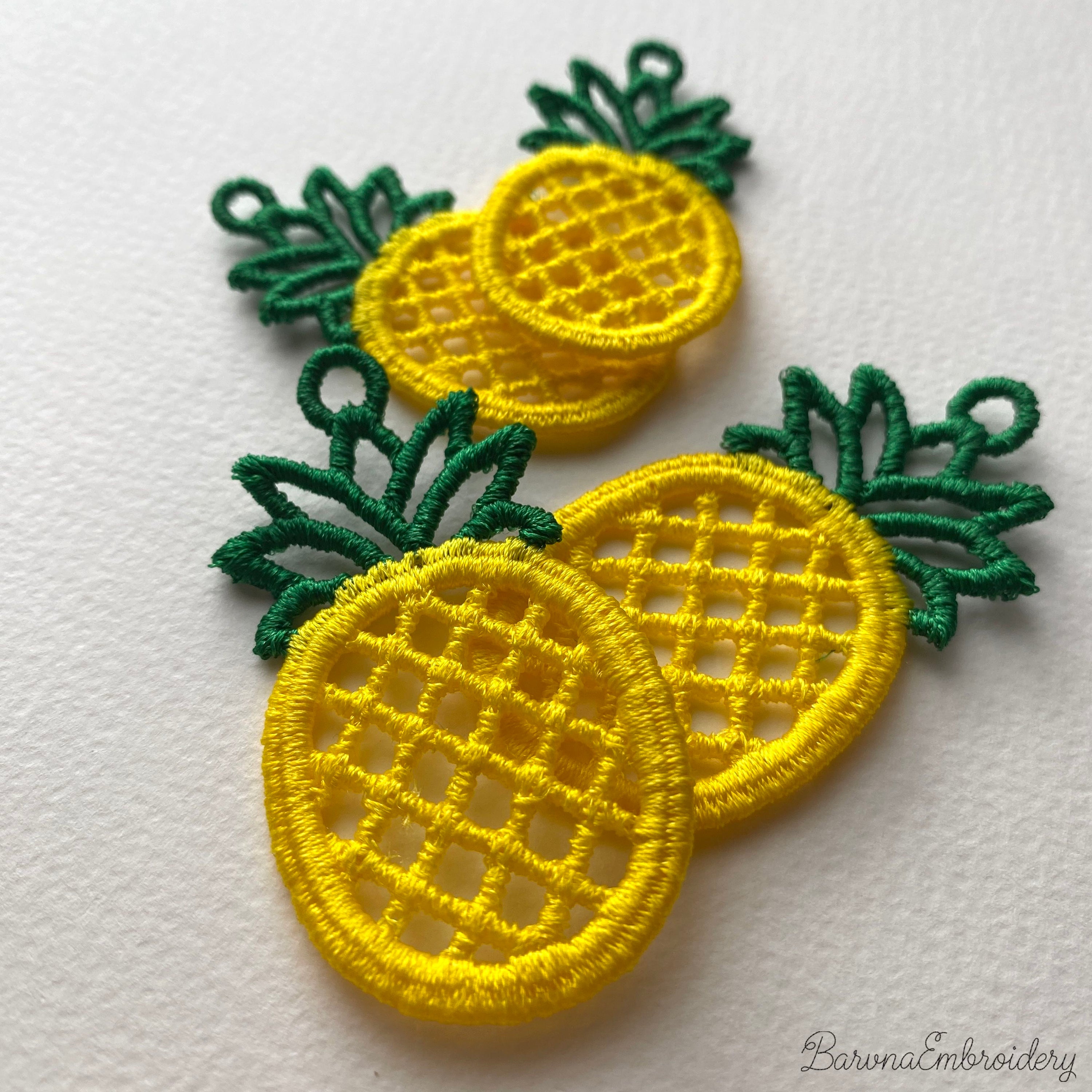 FSL pineapple embroidery design previews — yellow lace body with green crown and hanging loop — Free Standing Lace machine embroidery pattern for earrings and pendants.