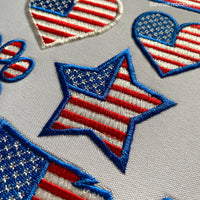 Machine embroidery design of a star filled with the USA flag, perfect for patriotic decorations and patches.
