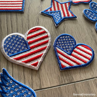 Machine embroidery design of the USA flag in the shape of a heart, perfect for patriotic projects.