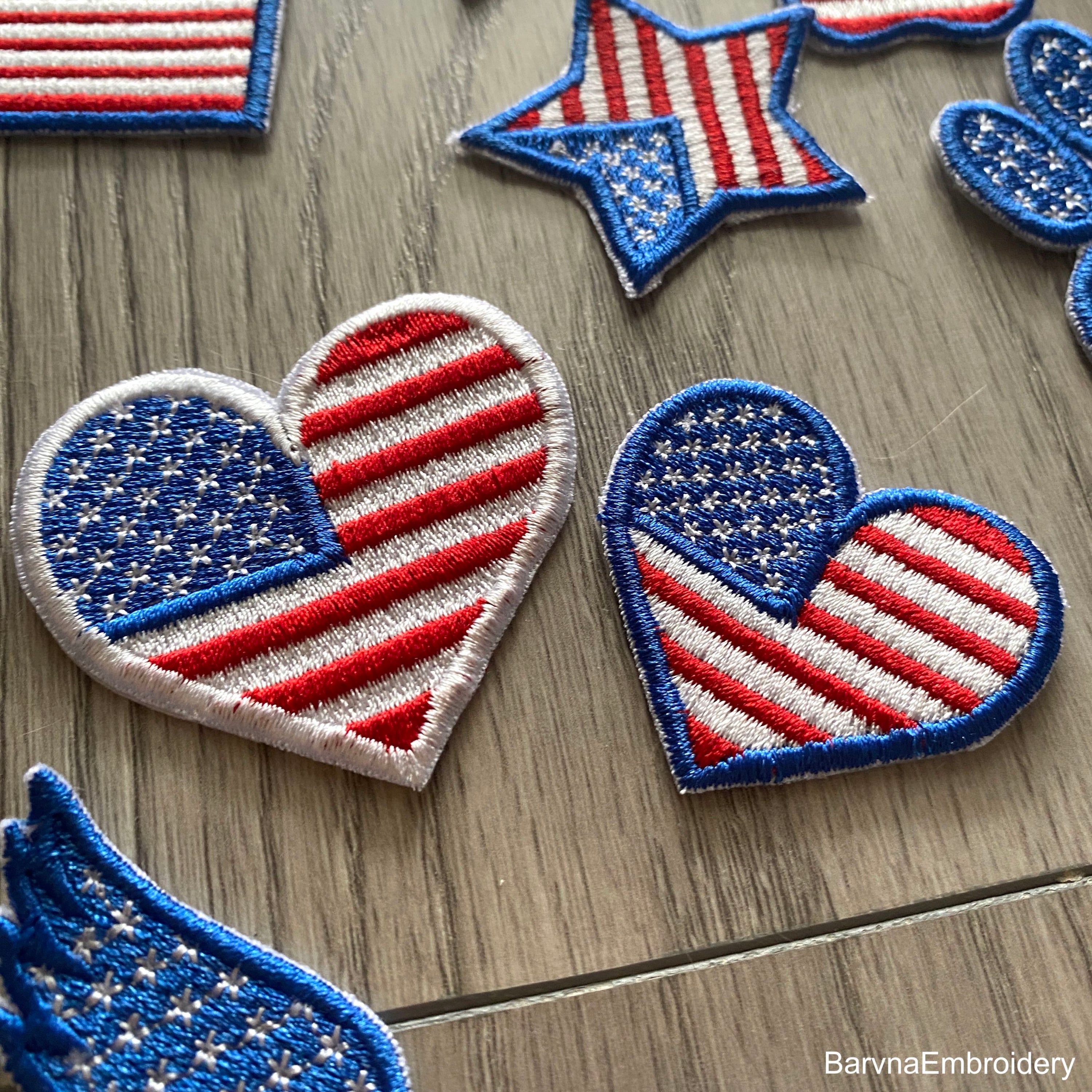 Machine embroidery design of the USA flag in the shape of a heart, perfect for patriotic projects.