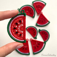 Two mirrored FSL watermelon slice earrings — a machine embroidery design in Free Standing Lace technique, showing red lace fill, black seeds, and green border with a hanging loop.