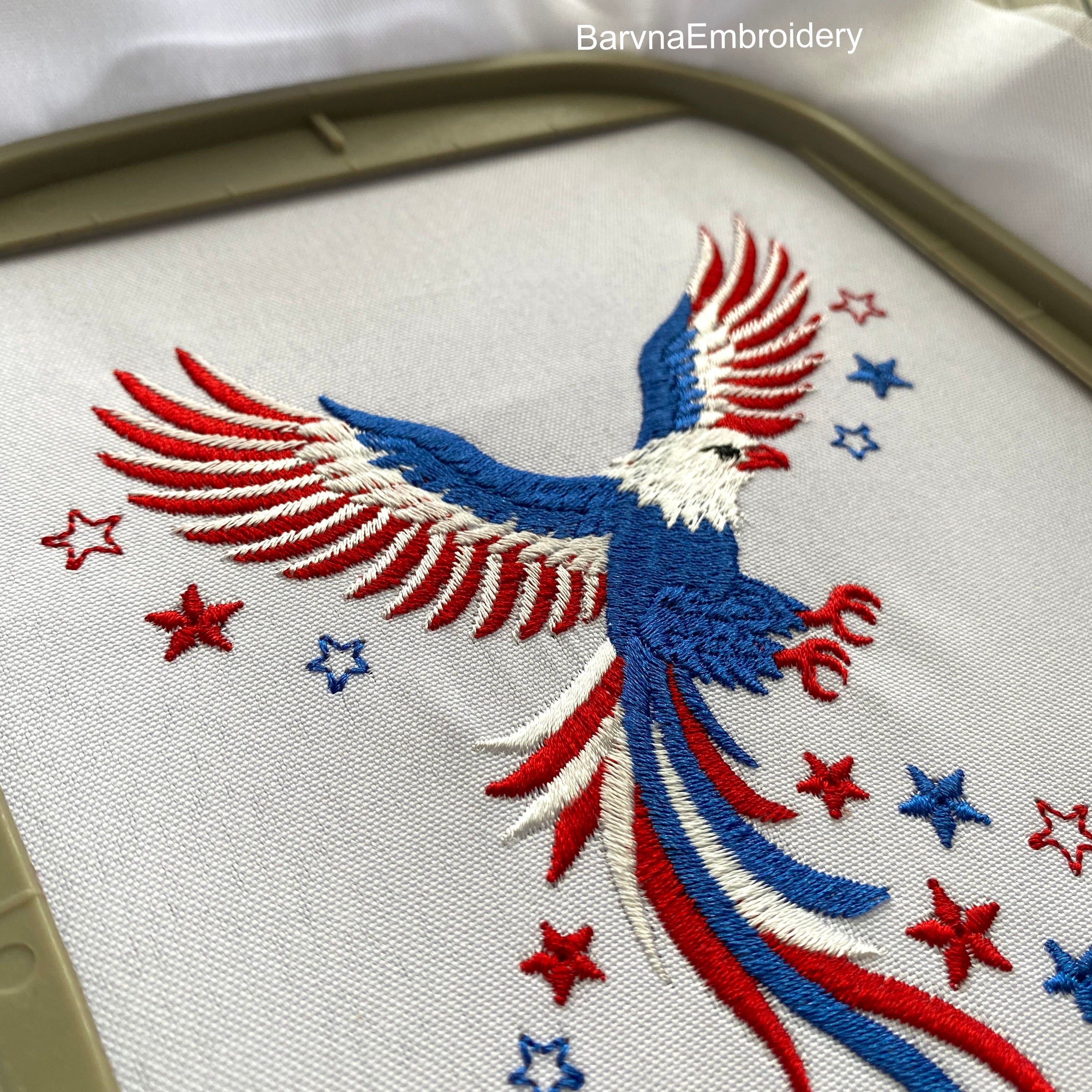 Machine embroidery design of an American eagle in red, white, and blue, with patriotic stars in flying motion, ideal for 4th of July and USA-themed projects.