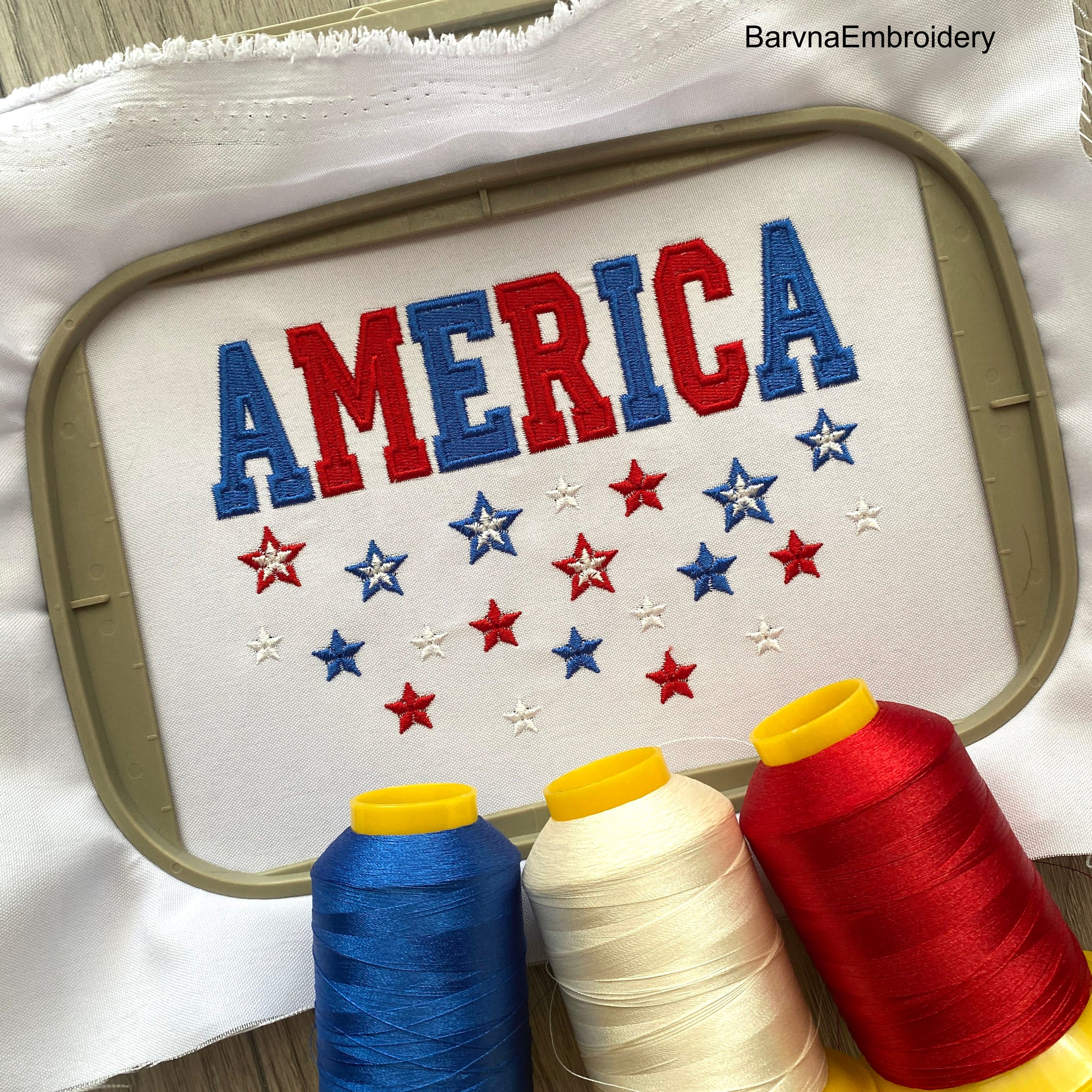 Machine embroidery design featuring the word “America” in bold red and blue letters with scattered red, white, and blue stars below, perfect for patriotic projects.