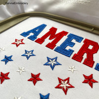 Machine embroidery design featuring the word “America” in bold red and blue letters with scattered red, white, and blue stars below, perfect for patriotic projects.