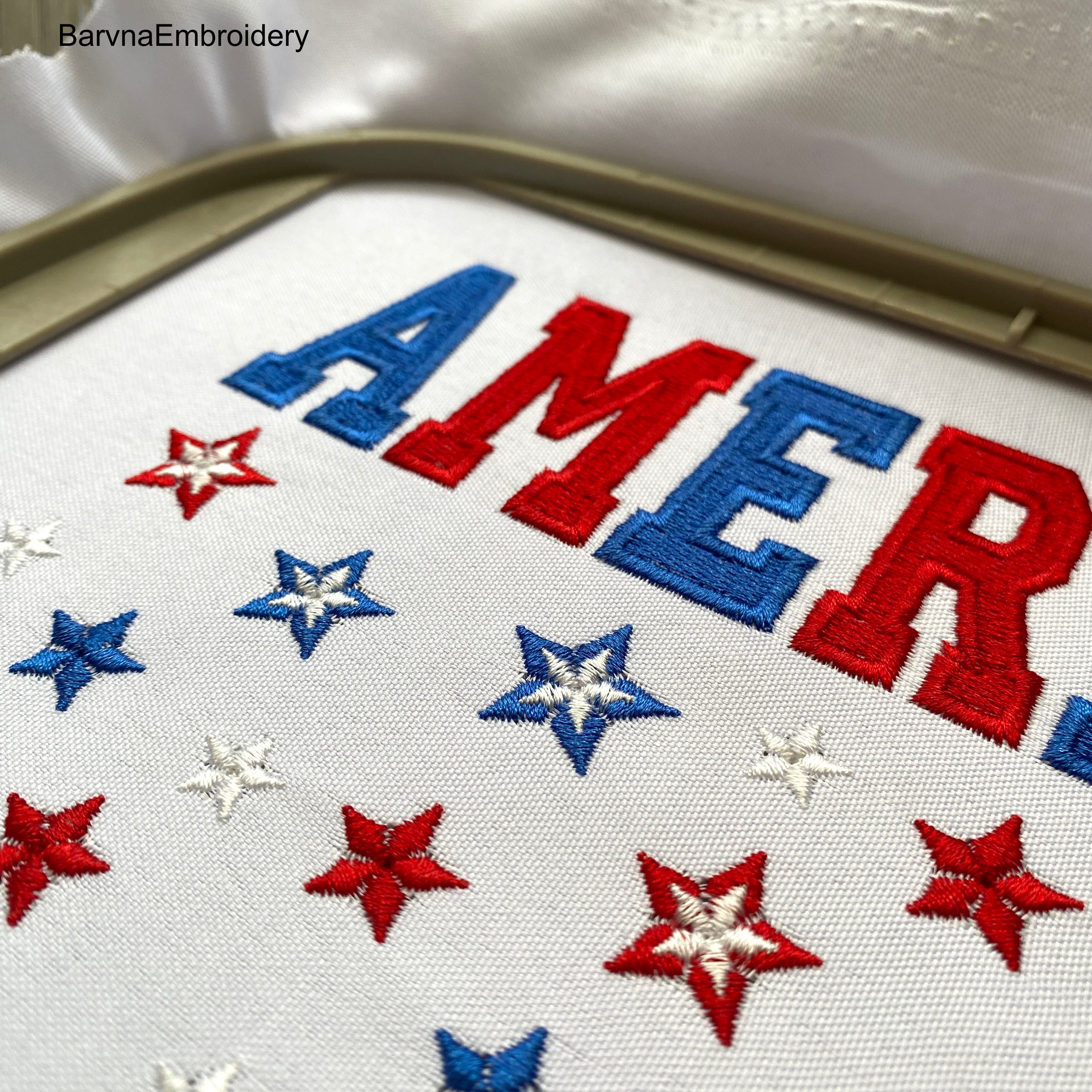 Machine embroidery design featuring the word “America” in bold red and blue letters with scattered red, white, and blue stars below, perfect for patriotic projects.