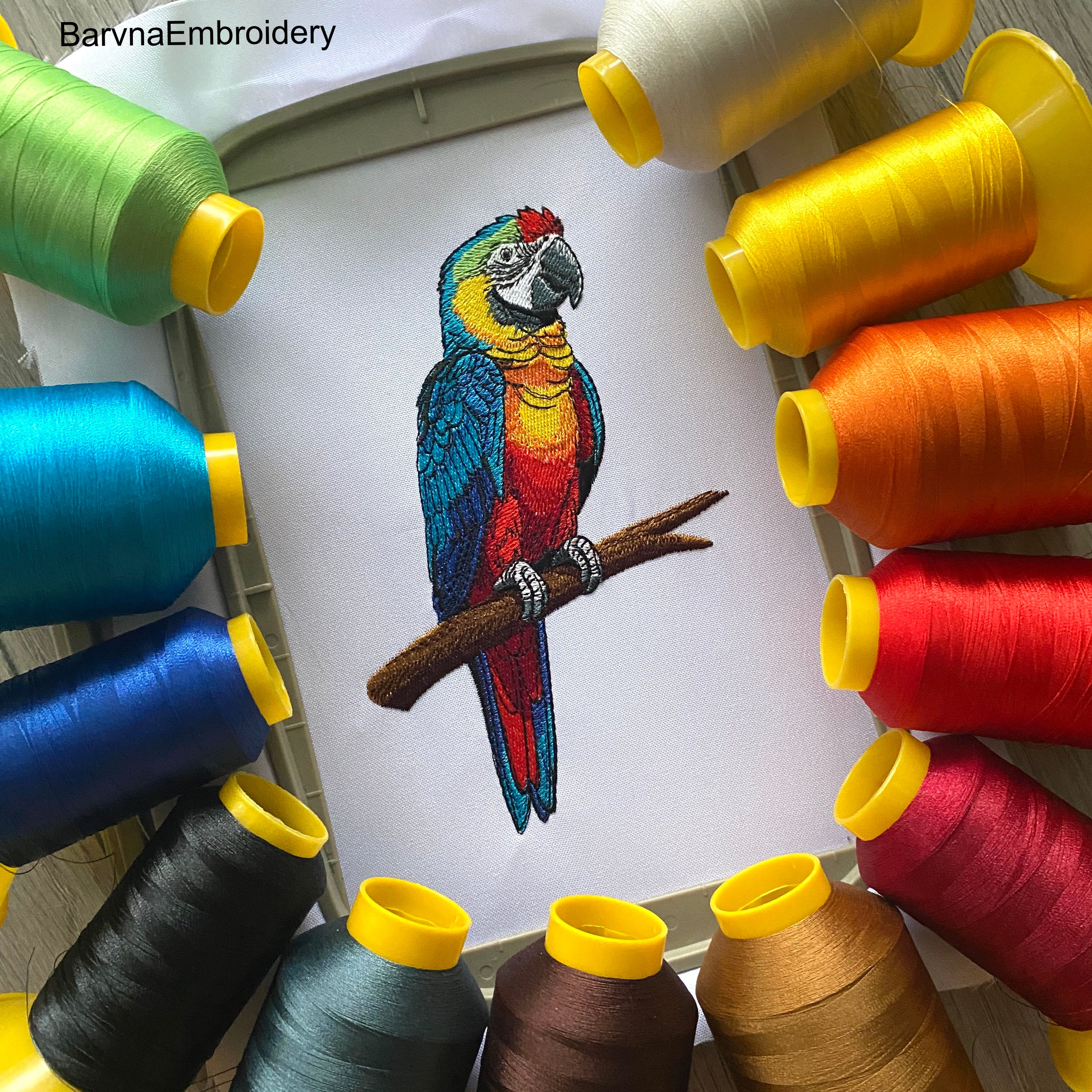 Colorful macaw parrot machine embroidery design sitting on a branch, digital file for embroidery machines.