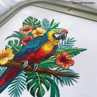 Colorful macaw parrot machine embroidery design with tropical flowers and leaves, digital file for embroidery machines.