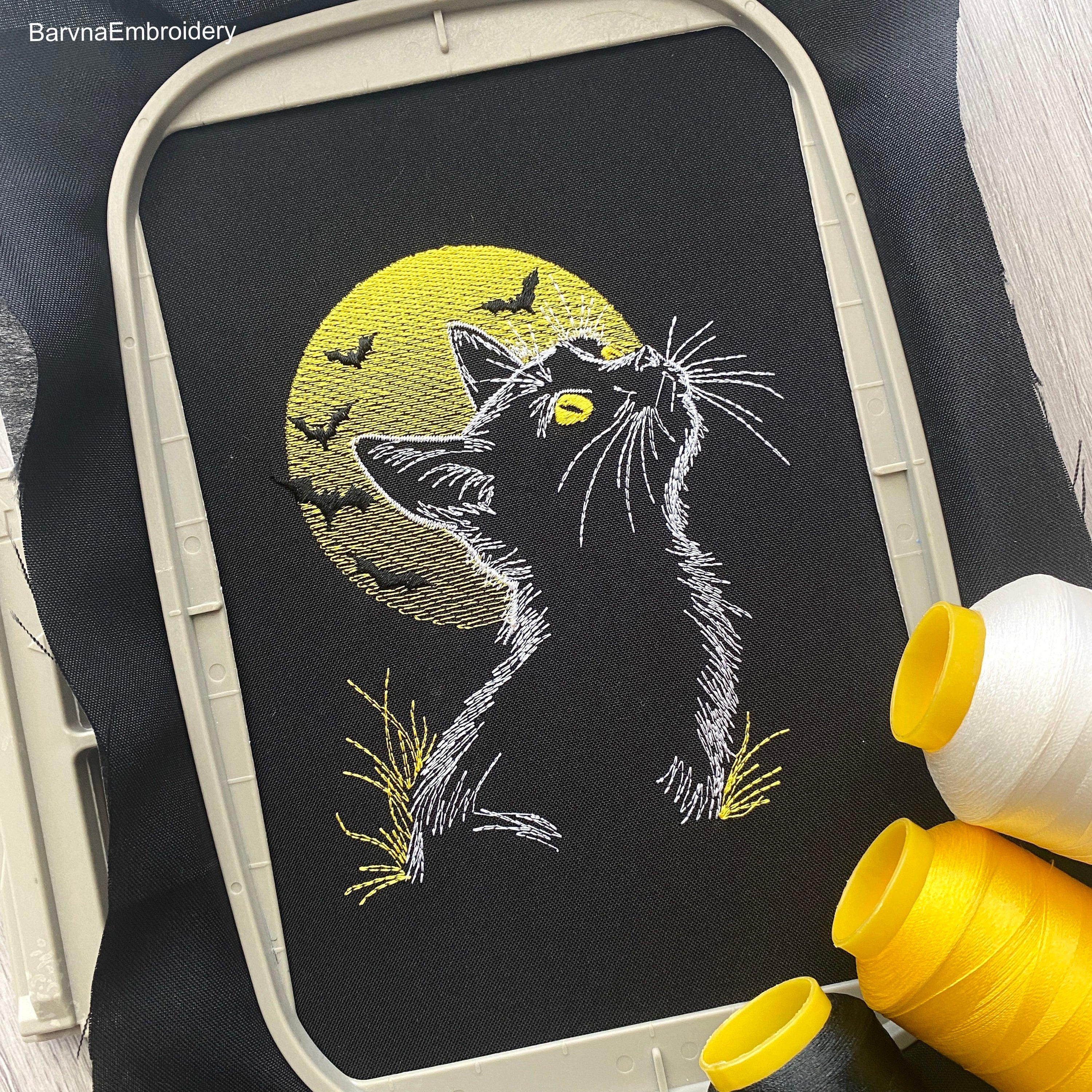 Spooky Halloween embroidery design with cat silhouette, moon, and bats – perfect for stitching on dark fabric.