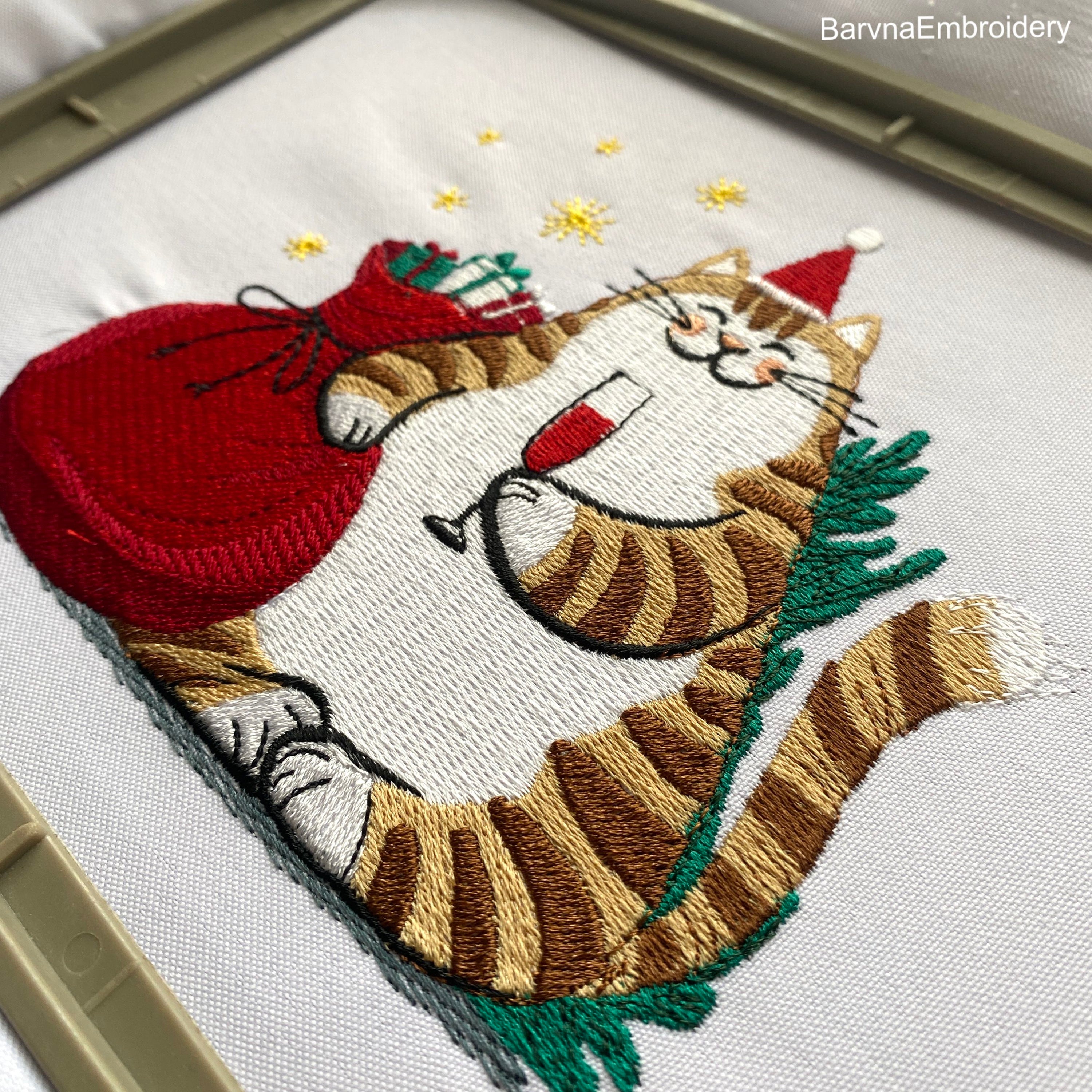 Festive Christmas embroidery design with a funny Santa cat – digital file for holiday machine embroidery projects.