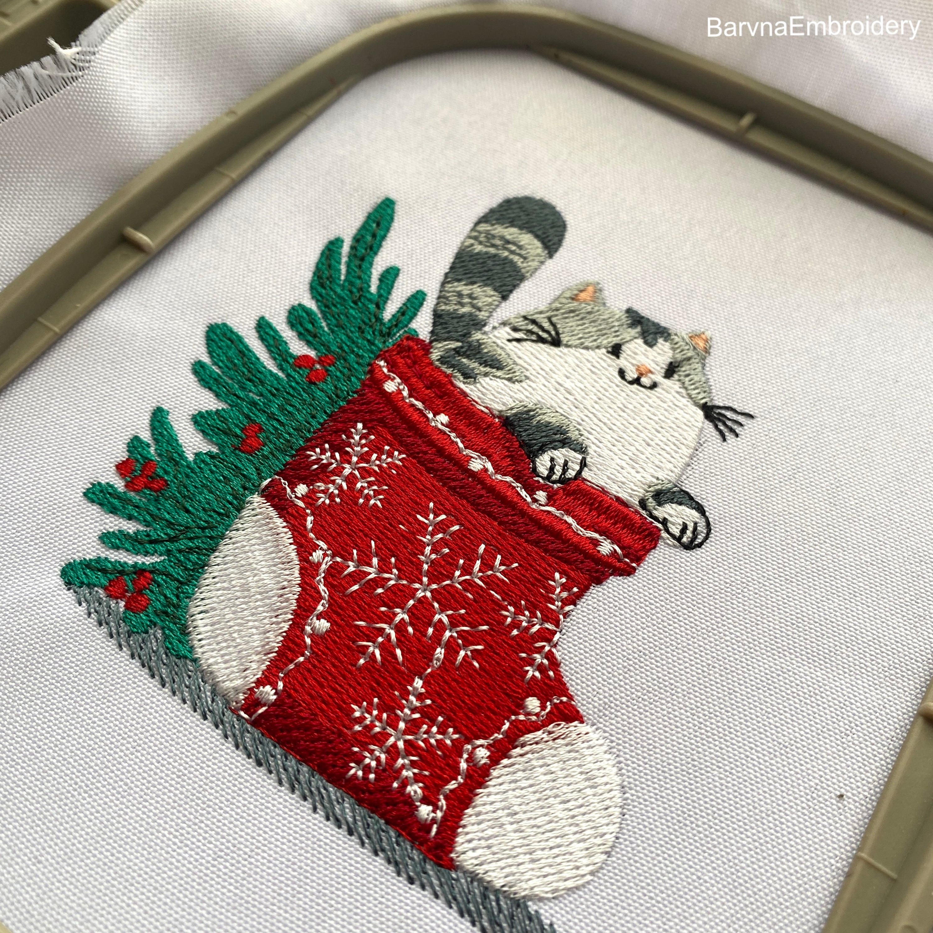 Festive Christmas embroidery design with a cute cat in a holiday stocking – digital file for machine embroidery projects.