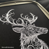 Deer head side view embroidery design with swirls – digital one-color embroidery file for Christmas and winter decor.