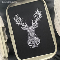 Deer head embroidery design with swirl details – one-color digital machine embroidery file for holiday and winter projects.
