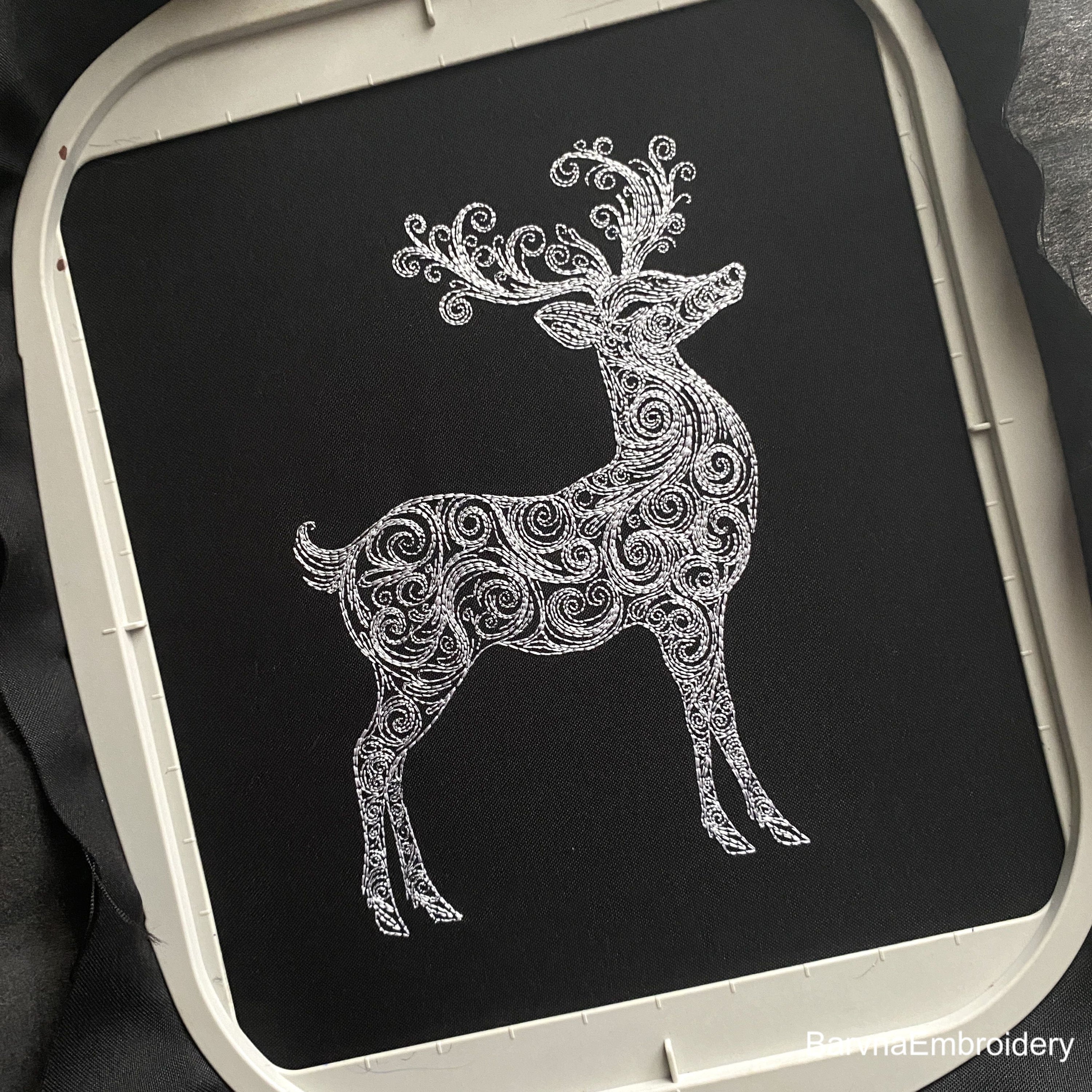 Standing deer embroidery design with swirls – one-color digital machine embroidery file for festive and seasonal projects.