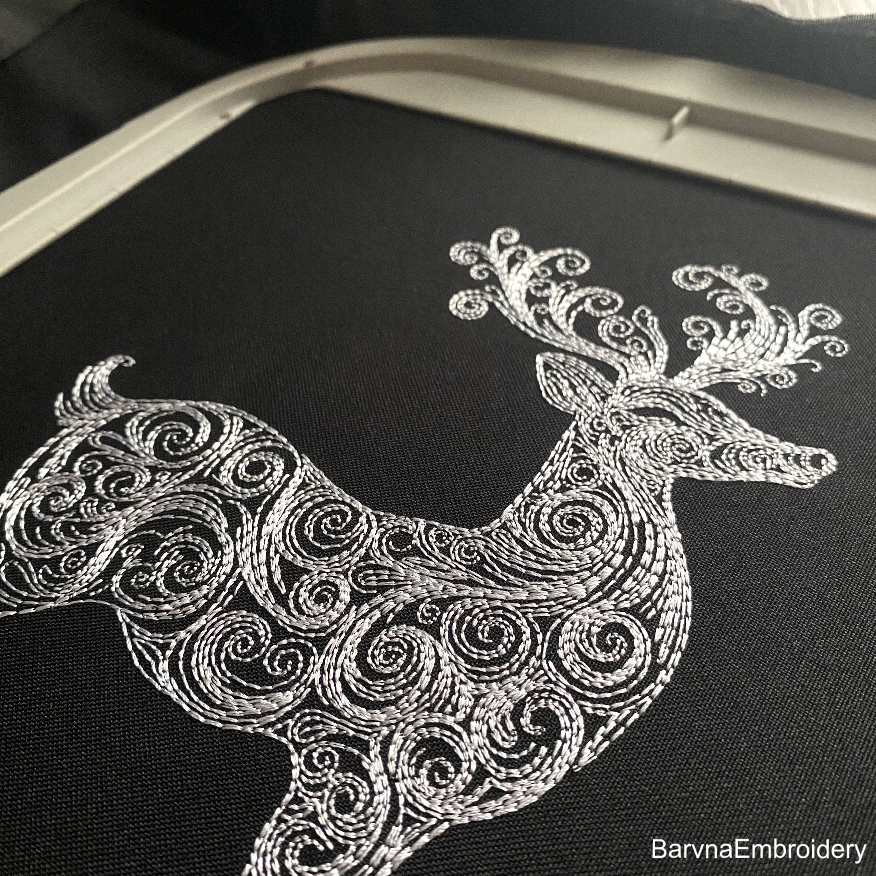 Standing deer embroidery design with swirls – one-color digital machine embroidery file for festive and seasonal projects.