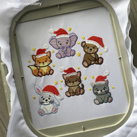 Set of six mini Christmas machine embroidery designs — bunny, fox, cat, bear, elephant, and tiger in Santa hats. Perfect for kids, fits 4x4 hoop.