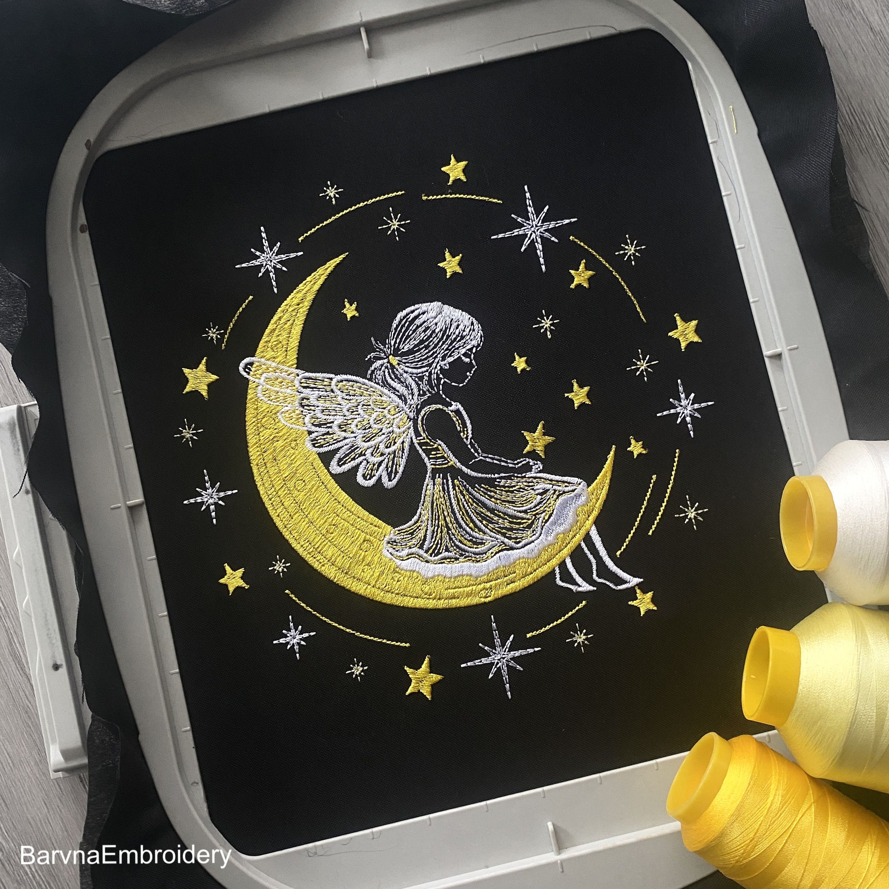 Machine embroidery design of angel girl sitting on the moon surrounded by stars, perfect for Christmas gifts and baby clothes.