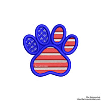 Machine embroidery design of a paw with the American flag inside, great for patriotic pet lovers.