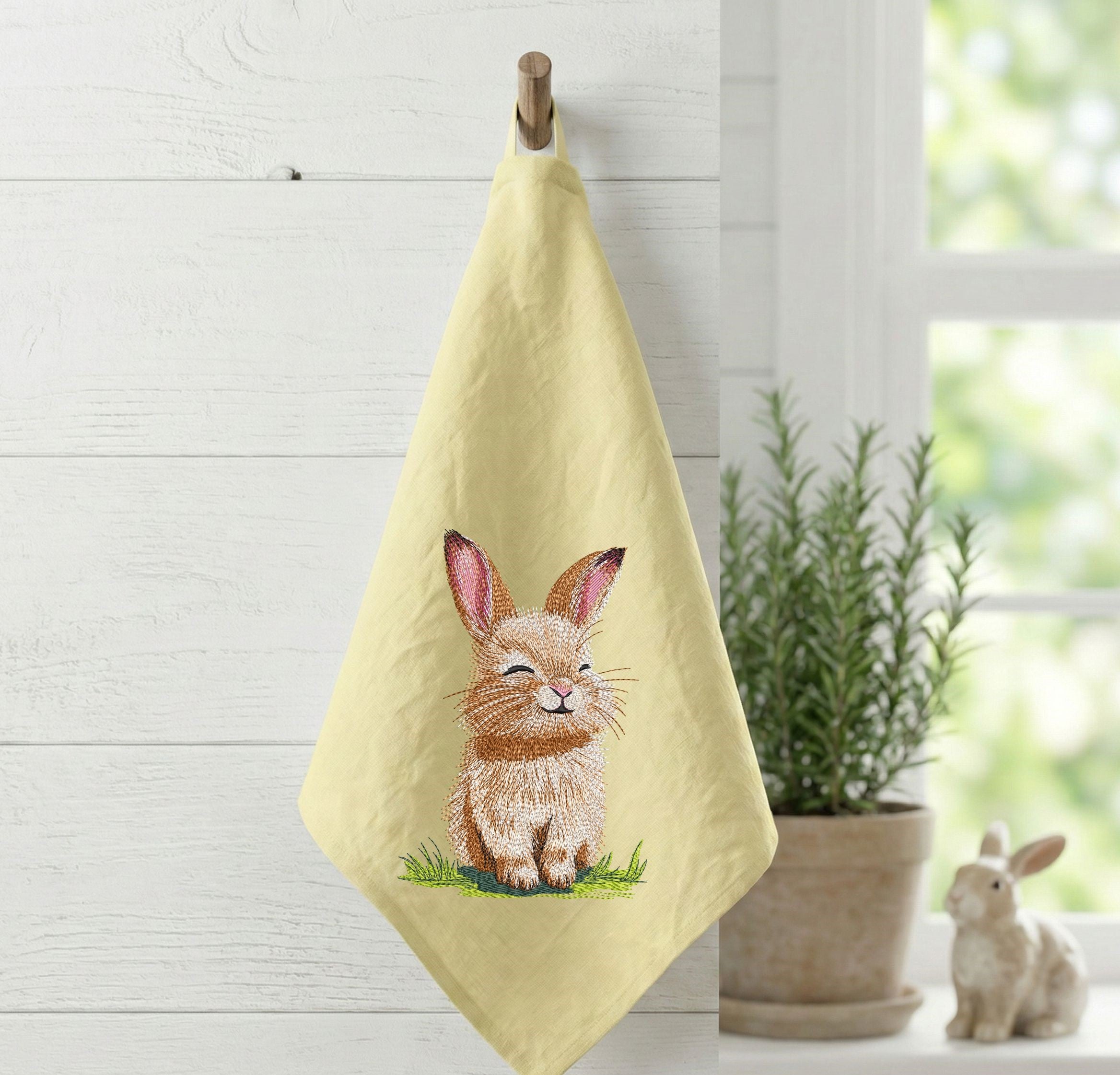 Cute bunny machine embroidery design sitting on grass, spring animal embroidery pattern for kids and seasonal projects