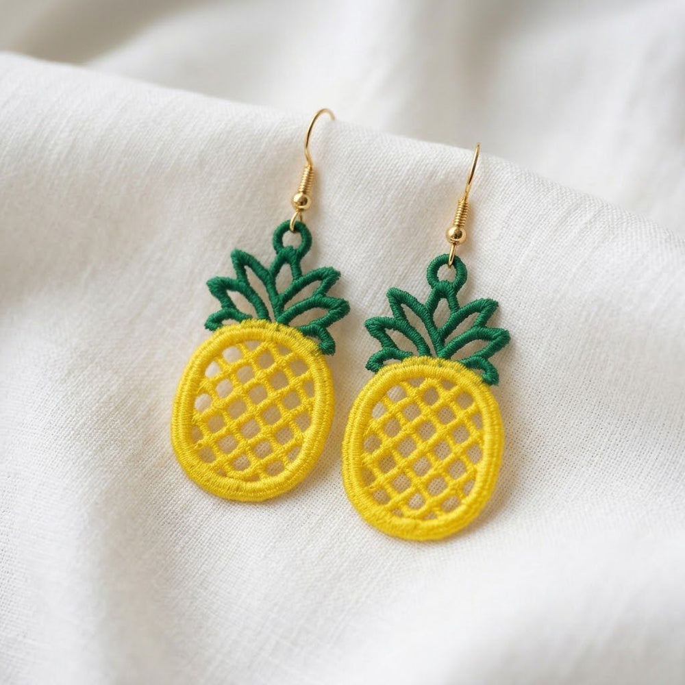 FSL pineapple embroidery design previews — yellow lace body with green crown and hanging loop — Free Standing Lace machine embroidery pattern for earrings and pendants.