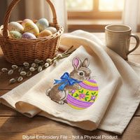 Cute Easter bunny with blue bow hugging decorated egg, spring machine embroidery design digital file for instant download.