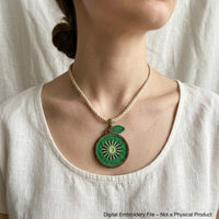 Four FSL kiwi embroidery designs in two styles — green kiwi cross-section and brown whole kiwi fruit — shown as mirrored pairs, Free Standing Lace machine embroidery pattern for earrings and pendants.