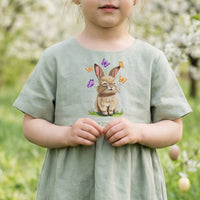 A collection of five high-quality machine embroidery designs: bunnies with butterflies, wildflowers, dandelions, and spring greenery in a realistic style.