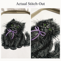 Actual black kitten embroidery on white fabric in a hoop, surrounded by thread spools in purple, green, gray and black.