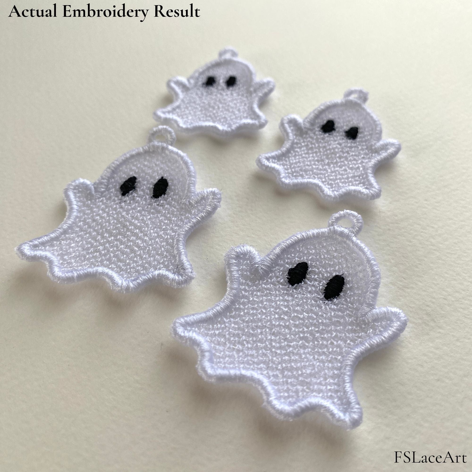 Four actual white Ghost FSL stitch-outs with black oval eyes, raised arms and hanging loops