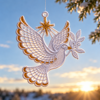 White lace dove with gold accents, an olive branch and a star, suspended against a blue sky with sunlight shining through its wings.