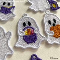 Close-up of an embroidered lace ghost holding a purple candy basket, showing the stitches and hanging loop.