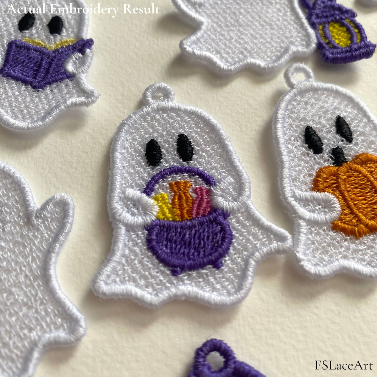 Close-up of an embroidered lace ghost holding a purple candy basket, showing the stitches and hanging loop.