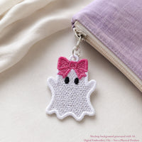 White Ghost Girl FSL zipper charm with a pink bow attached to a lavender fabric pouch